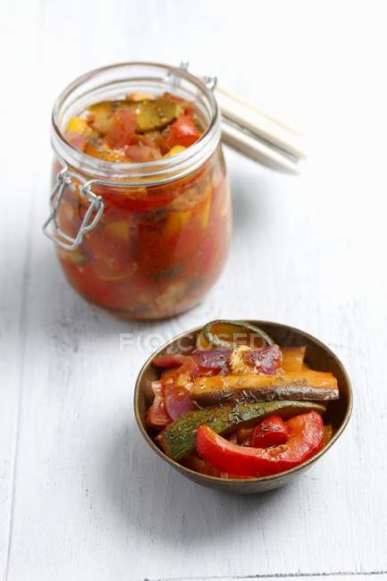 Ratatouille preserved in jar over white surface — Stock Photo