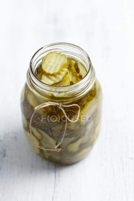 Pickled cucumbers in jar — Stock Photo