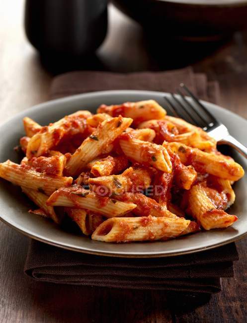 Penne sorentina pasta with tomato sauce — Stock Photo