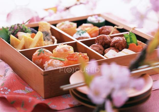 Closeup view of Japanese box with different dishes — Stock Photo