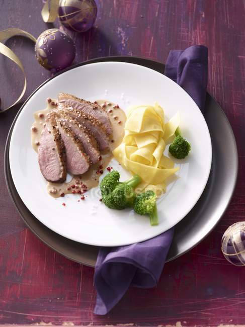Duck breast with tagliatelle pasta — Stock Photo