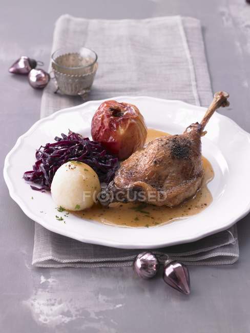 Goose leg with a baked apple — Stock Photo