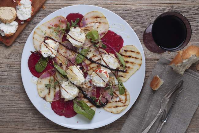 Beetroot carpaccio with fruit — Stock Photo
