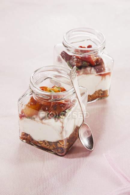 Layered desserts with muesli — Stock Photo