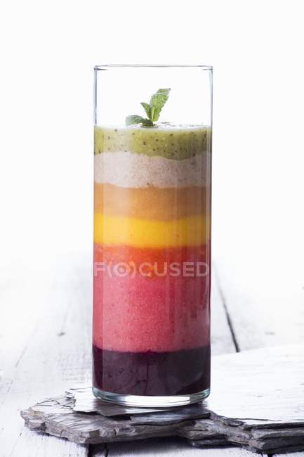 Colourful layered smoothie — Stock Photo