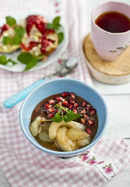 Chocolate porridge with honey, apples and pomegranate — Stock Photo