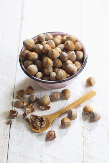 Hazelnuts in bowl with shell — Stock Photo