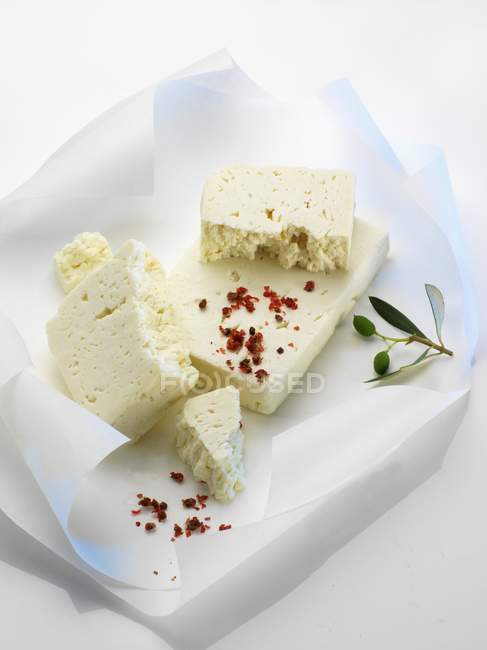 Feta cheese on paper — Stock Photo