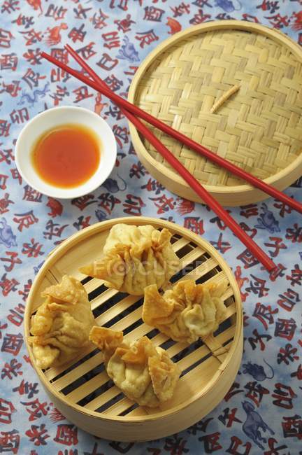 Elevated view of fried Wontons with chilli sauce — Stock Photo