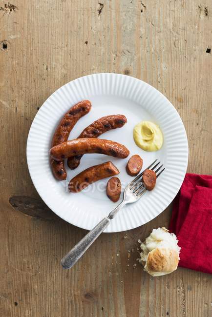 Grilled Merguez sausages with mustard — Stock Photo