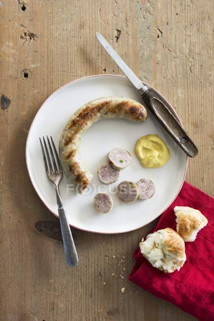 Grilled sausage with mustard — Stock Photo