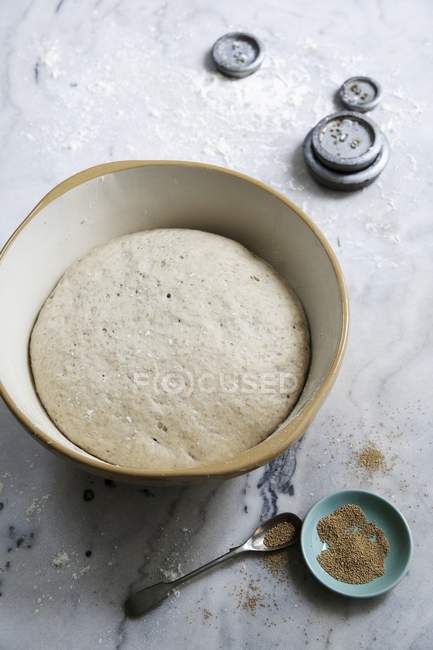 Bread dough in bowl — Stock Photo