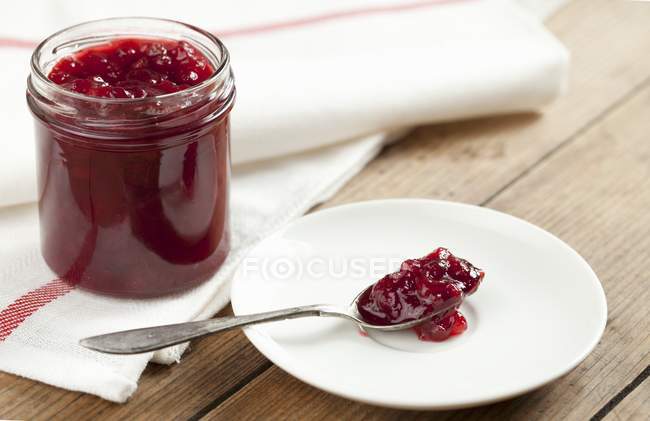 Red berry jam in jar — Stock Photo