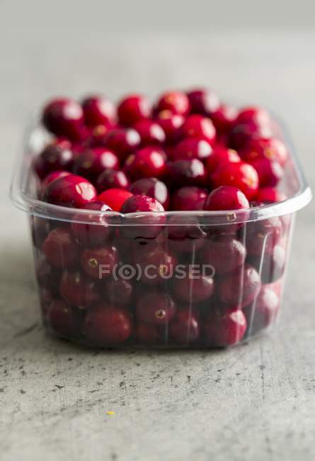 Cranberries in plastic punnet — Stock Photo