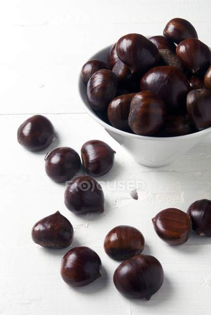 Whole Chestnuts in bowl — Stock Photo