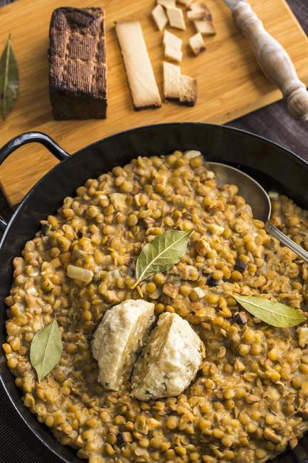 Closeup top view of lentils with a bacon dumpling — Stock Photo