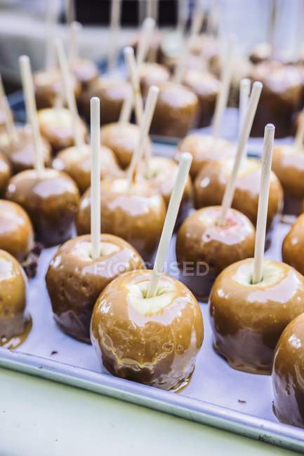 Toffee apples with sticks — Stock Photo