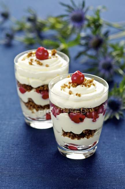 Desert with cherries and cream — Stock Photo