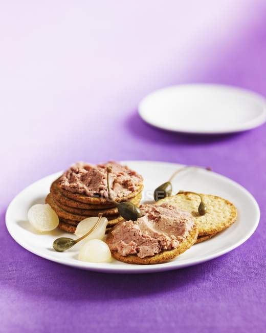 Biscuits with liver capers — Stock Photo