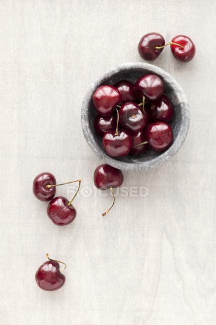 Fresh cherries in marbled bowl — Stock Photo