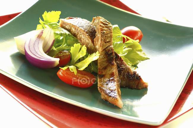 Beef salad on plates — Stock Photo