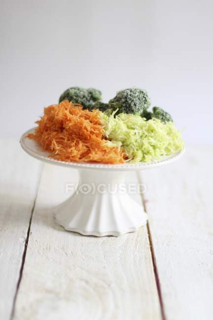 Grated vegetables on cake stand — Stock Photo