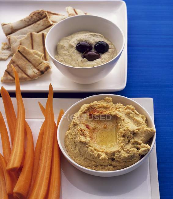 Various dips with carrot — Stock Photo