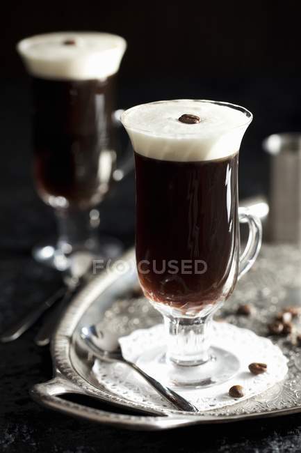 Coffee with liqueur on tray — Stock Photo