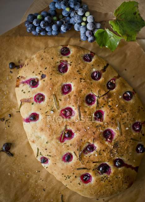 Focaccia with grapes and rosemary — Stock Photo
