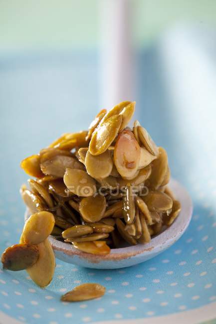 Pumpkin seeds in honey — Stock Photo