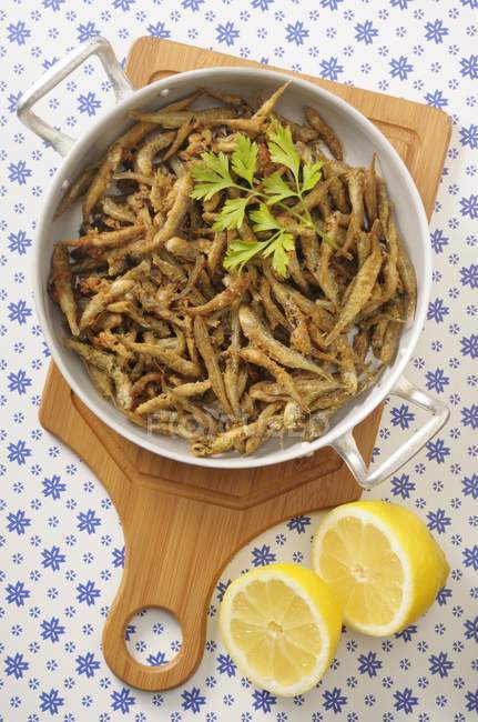 Fried anchovies in pan — Stock Photo