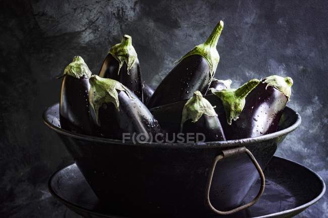 Aubergines in metal bowl — Stock Photo