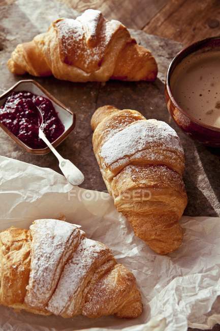 Butter croissants with raspberry jam — Stock Photo