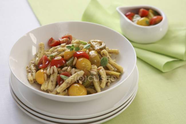 Pasta with colourful tomatoes — Stock Photo