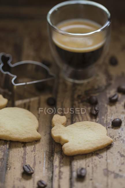 Glass of espresso with biscuit — Stock Photo