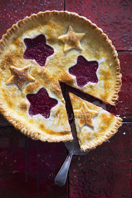 Raspberry pie with pastry stars — Stock Photo