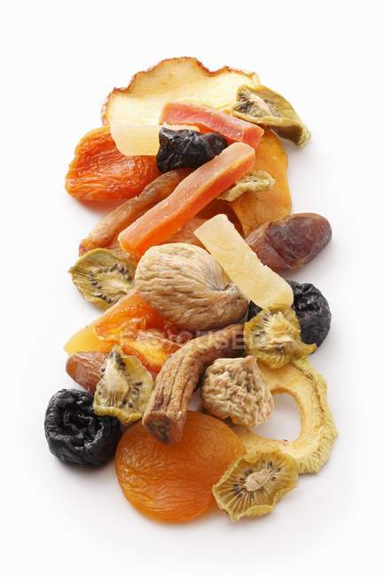 Closeup view of dried candied fruit on white surface — Stock Photo