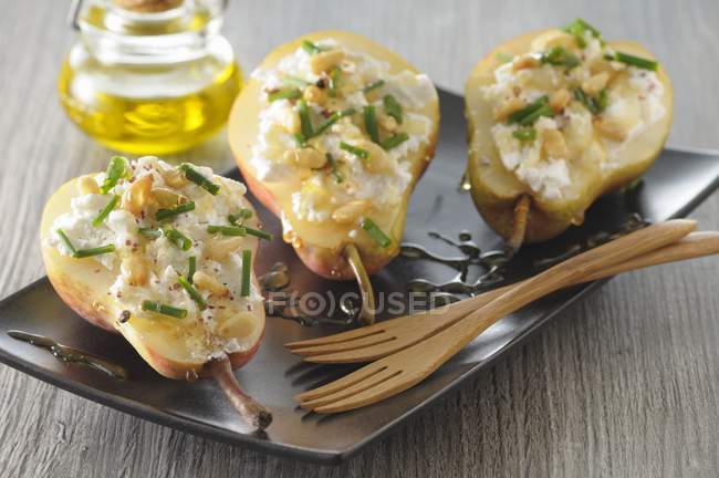 Stuff pears with cheese — Stock Photo