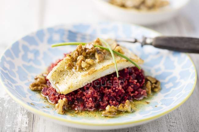 Zander on bed of beetroot couscous — Stock Photo