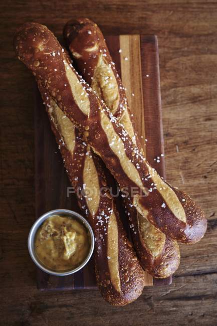 Pretzel baguettes with mustard — Stock Photo