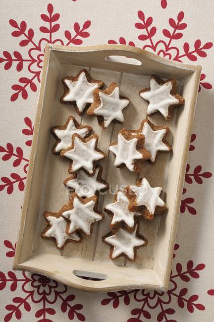 Cinnamon stars on a wooden tray — Stock Photo