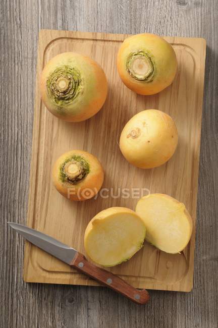 Whole and halved Yellow turnips — Stock Photo