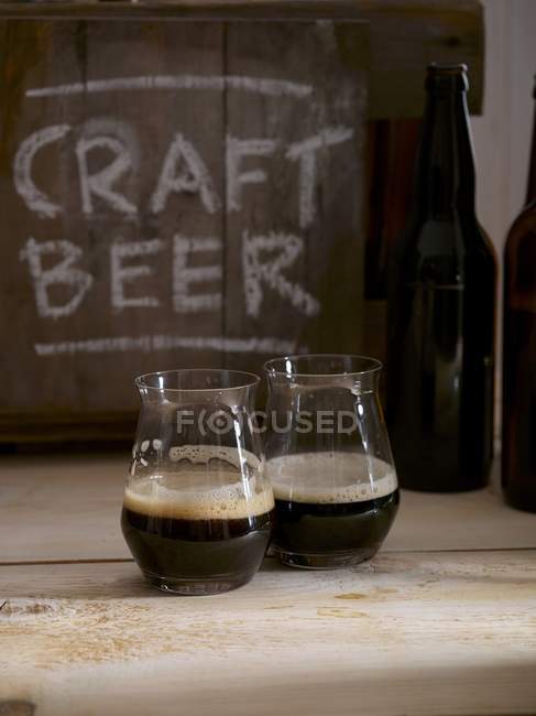 Two glasses of dark beer — Stock Photo