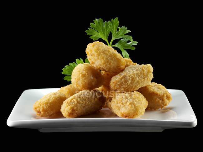 Closeup view of prawn nuggets heap with parsley — Stock Photo