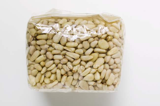 Pine nuts in cellophane packaging — Stock Photo