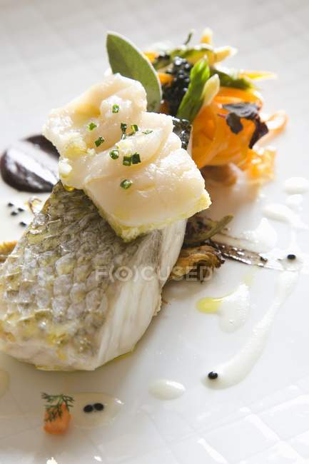 Sea bass fillet with vegetables — Stock Photo