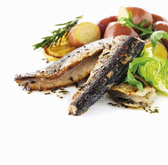 Grilled sardines with red potatoes — Stock Photo
