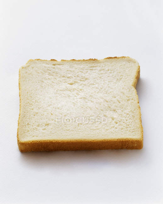 Tranche de pain blanc — Photo de stock