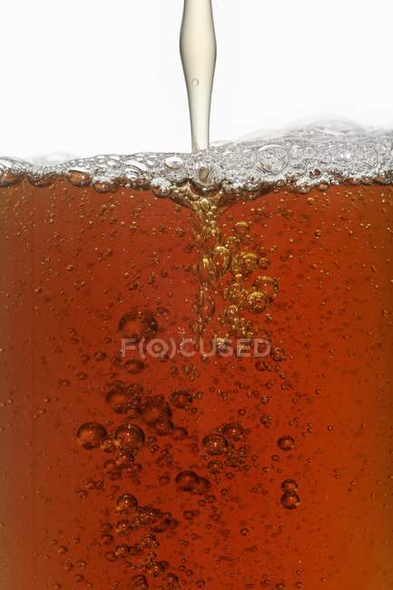 Closeup view of pouring fish broth — Stock Photo