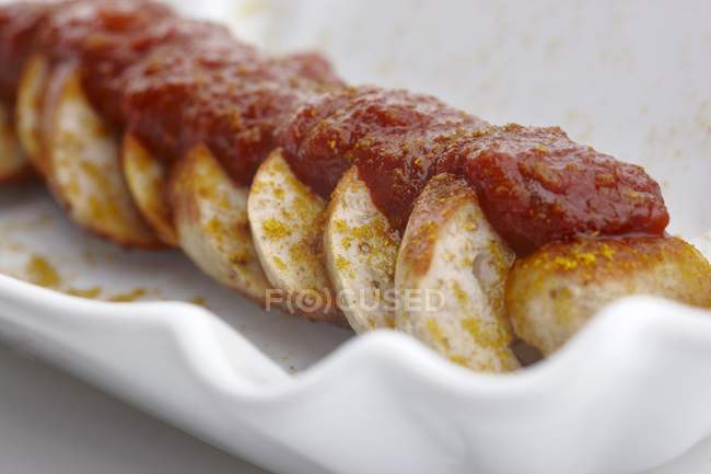 Salsicha com curry com ketchup — Fotografia de Stock